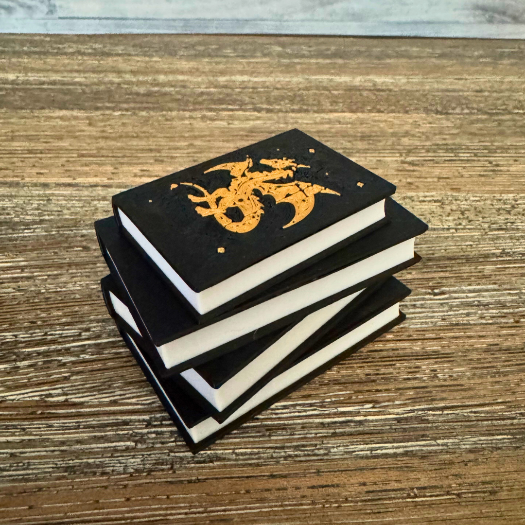 View of the Fantasy Dragon Book Light with the light turned off while sitting on a wooden table.