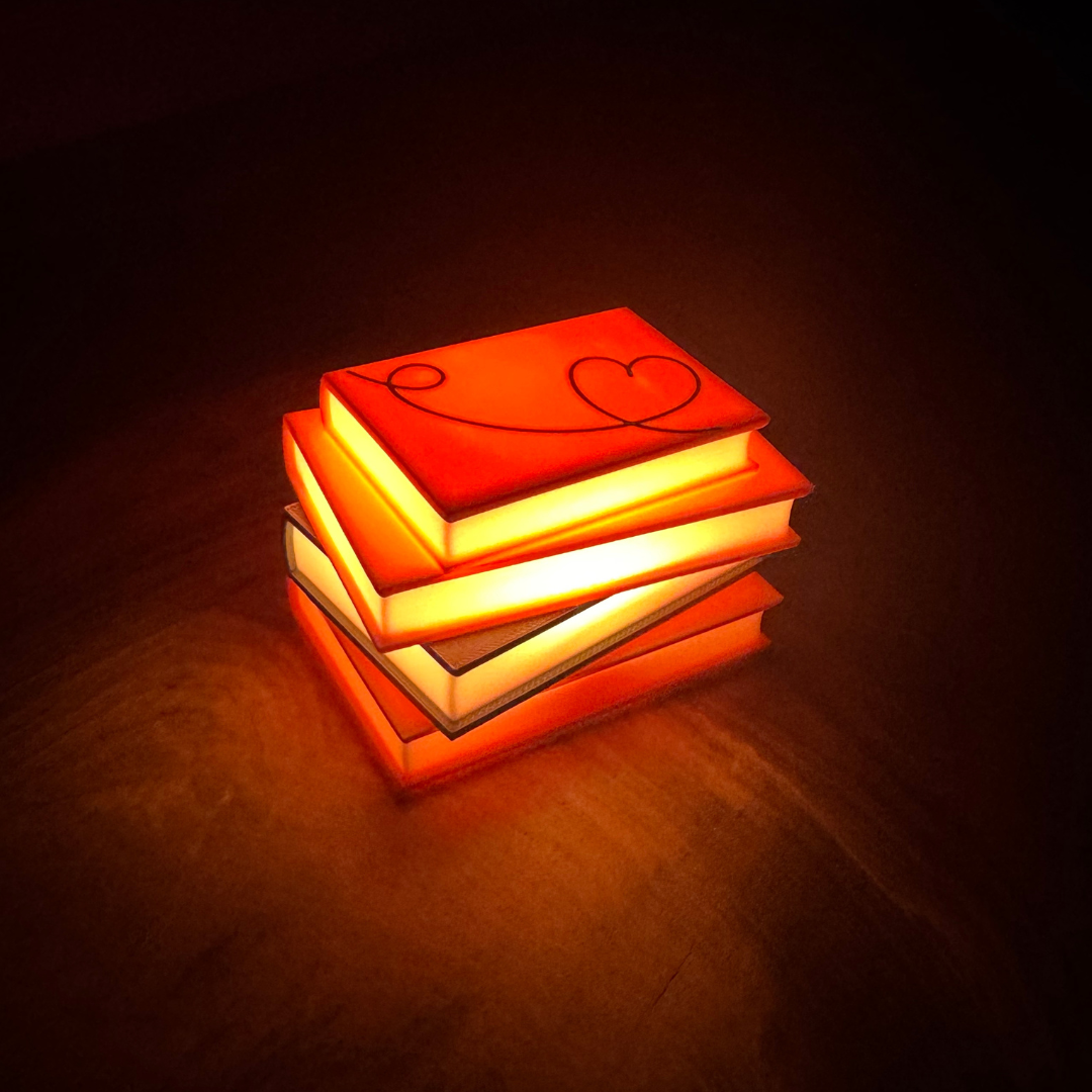 Front view of the romance novel light up stack of books.