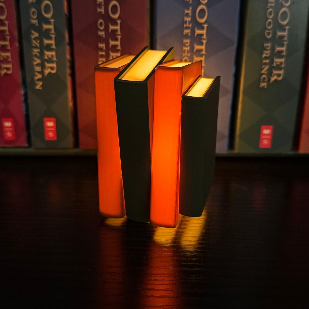 A view of the side bindings lit up on the cozy brown and green light up book stacks.