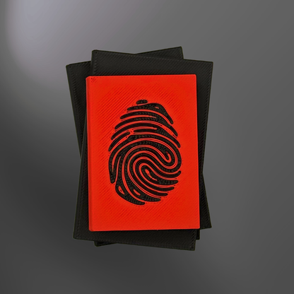 The top view of a true crime book light with the light turned off on a charcoal background.