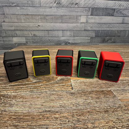 Back view of five TinyBrights™ Insert Coin Cubes showing the adjustable volume and brightness buttons, USB-C port, and rear panel design.