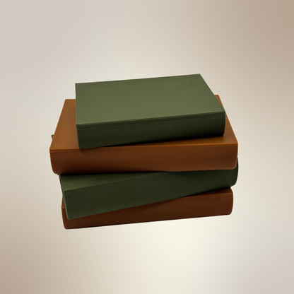 Cozy brown and green light up book stacks showing the book bindings with a tan background.