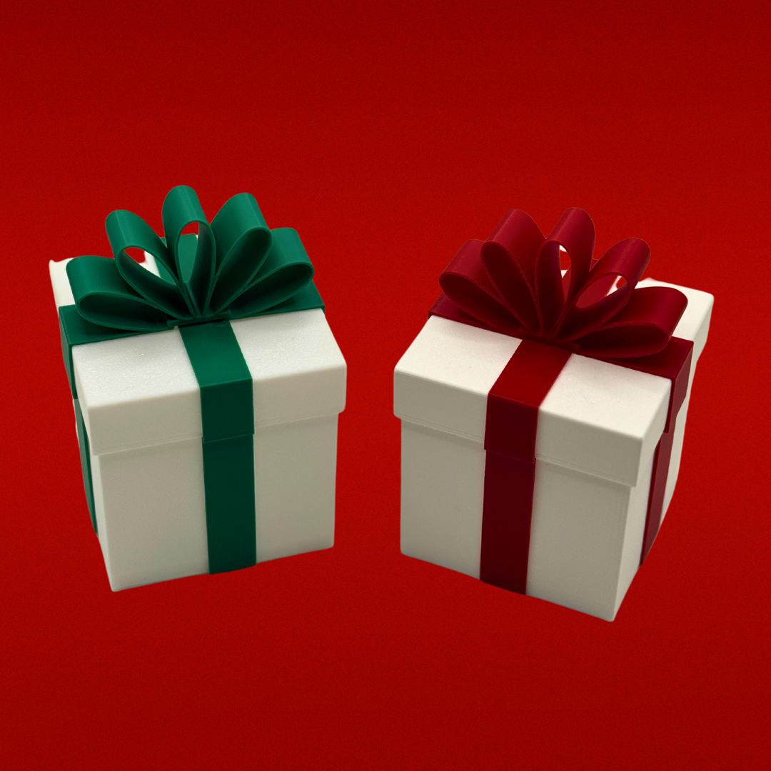 Two white Christmas packages that light up. One with a green ribbon and one with a red ribbon with a red background.