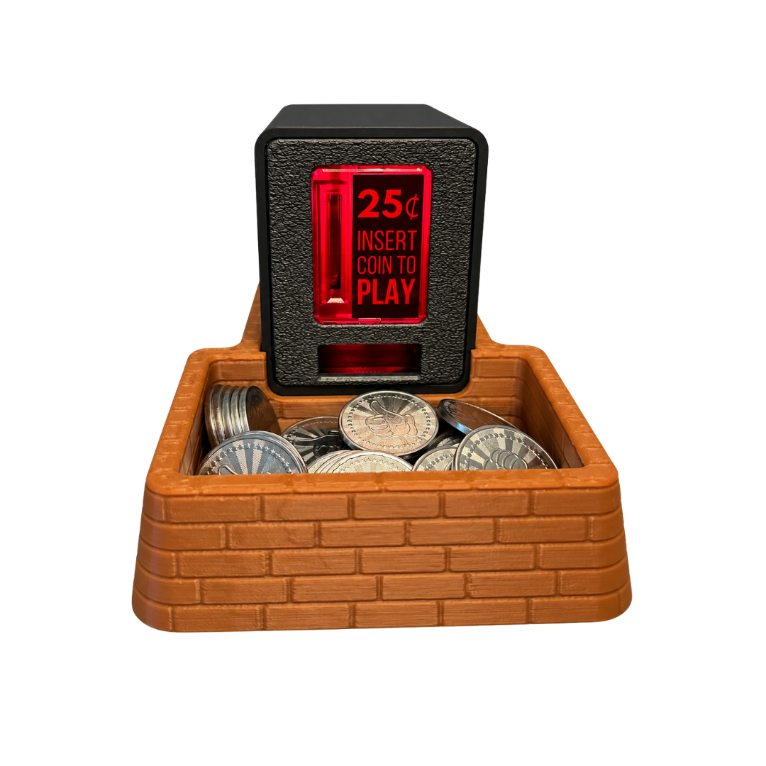 A brown brick coin tray with an Insert Coin Cube sitting on top filled with arcade tokens.
