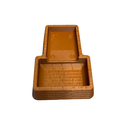 Inside of the brown brick coin tray.