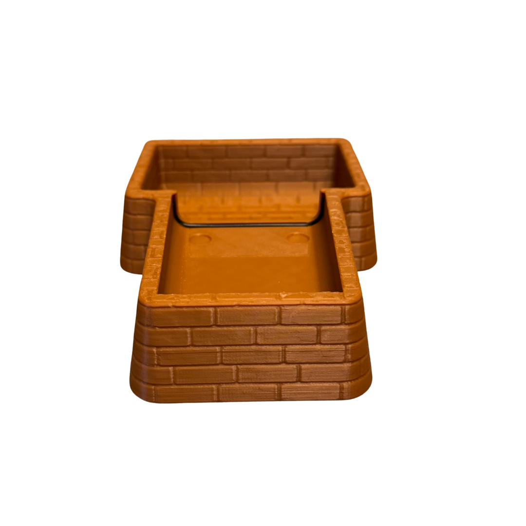 Inside of the brown brick coin tray.