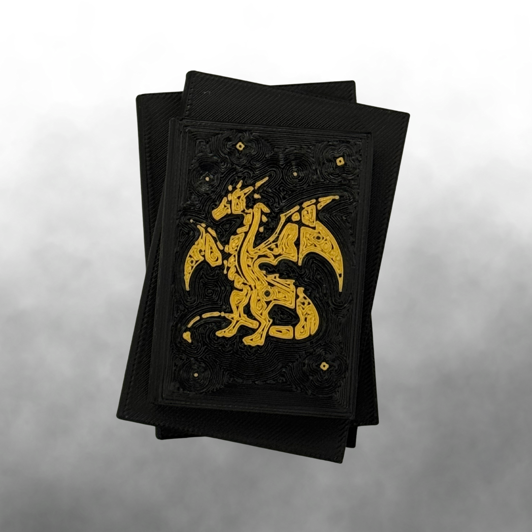 The top view of a fantasy dragon light up stack of books with the light turned off on a white and silver background.