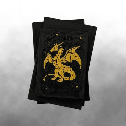 The top view of a fantasy dragon light up stack of books with the light turned off on a white and silver background.