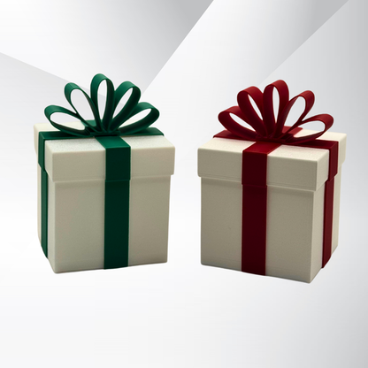 Two white Christmas packages that light up. One with a green ribbon and one with a red ribbon with a silver gradient background.