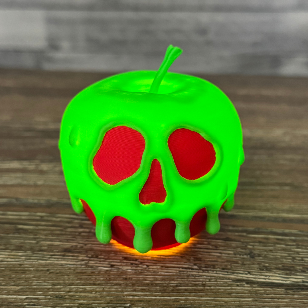 A glowing poison candy apple on a white background casting an eerie light, ideal for Halloween decor.