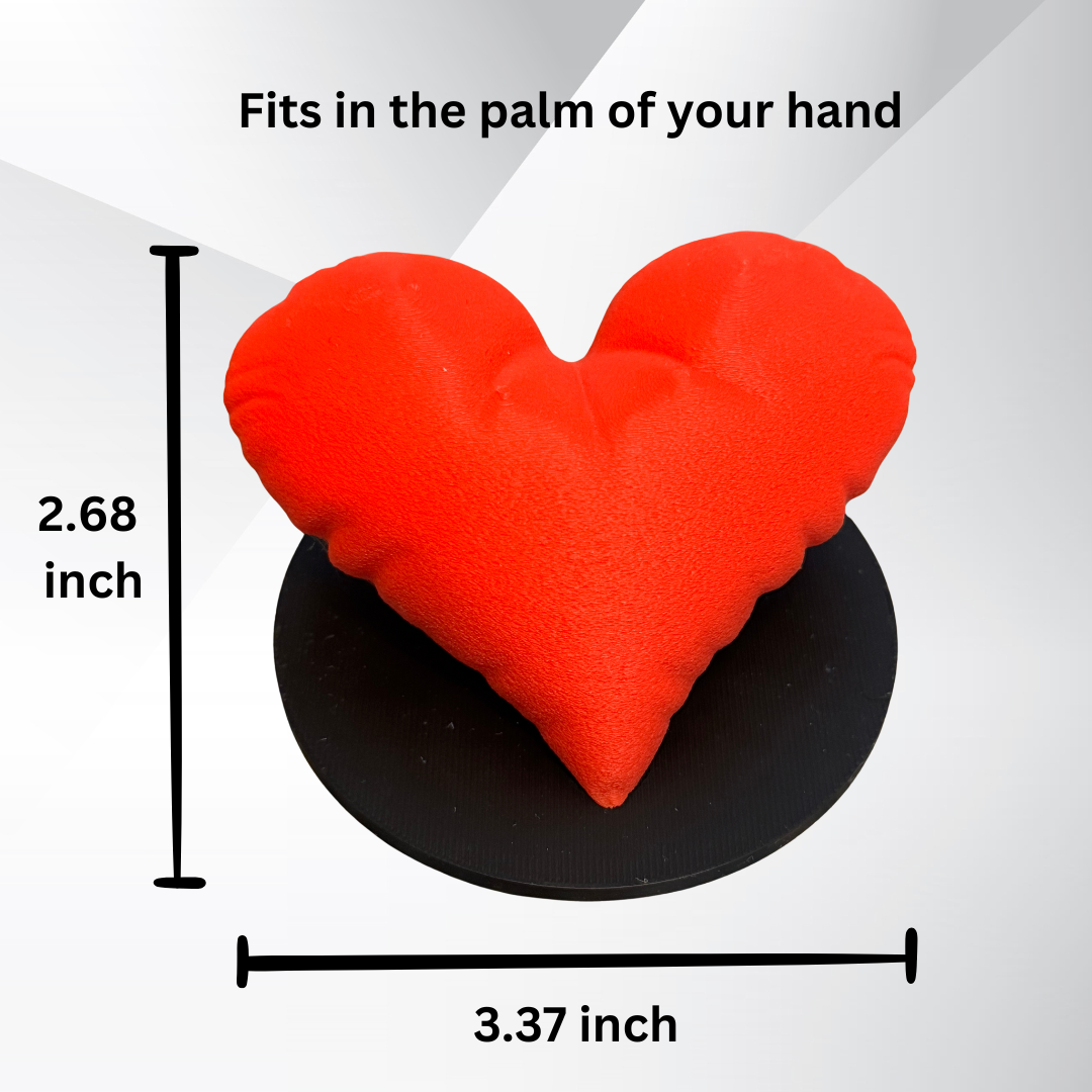 The measurements of the heart sculpture showing that it fits in the palm of your hand.
