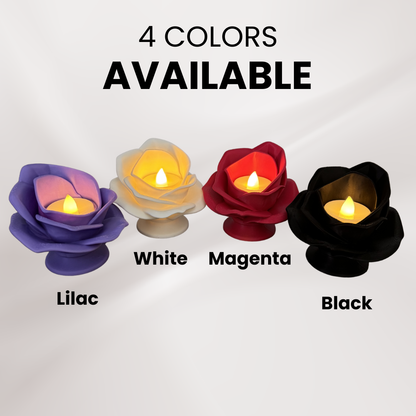 Four 3d printed rose tea light holders with a tea light turned on displaying all four color variations available on an off white background.