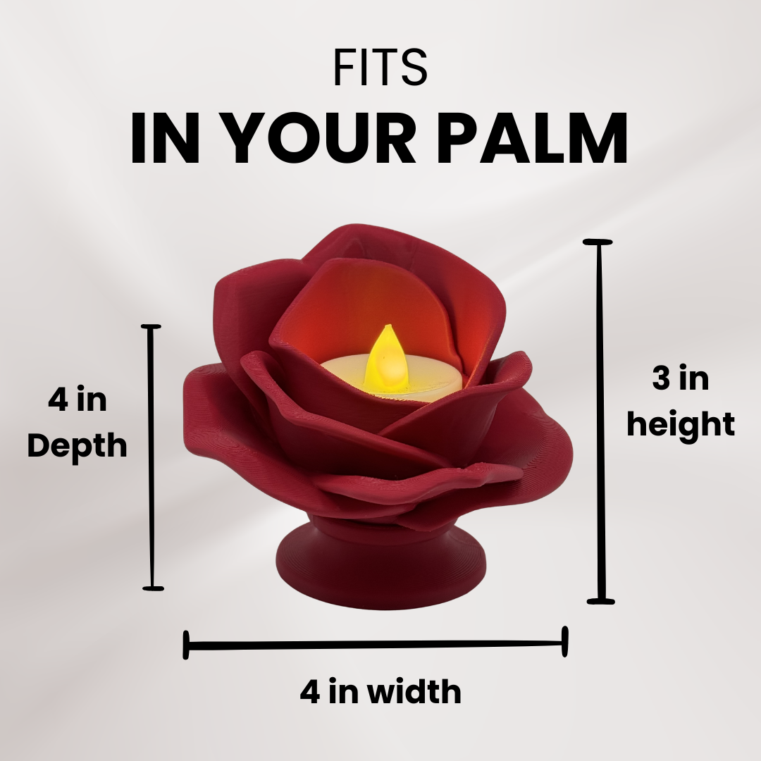 A 3d printed red rose tea light holder with a tea light turned on showing its measurements and that it fits in the palm of your hand.