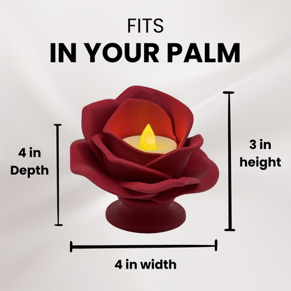 A 3d printed red rose tea light holder with a tea light turned on showing its measurements and that it fits in the palm of your hand.