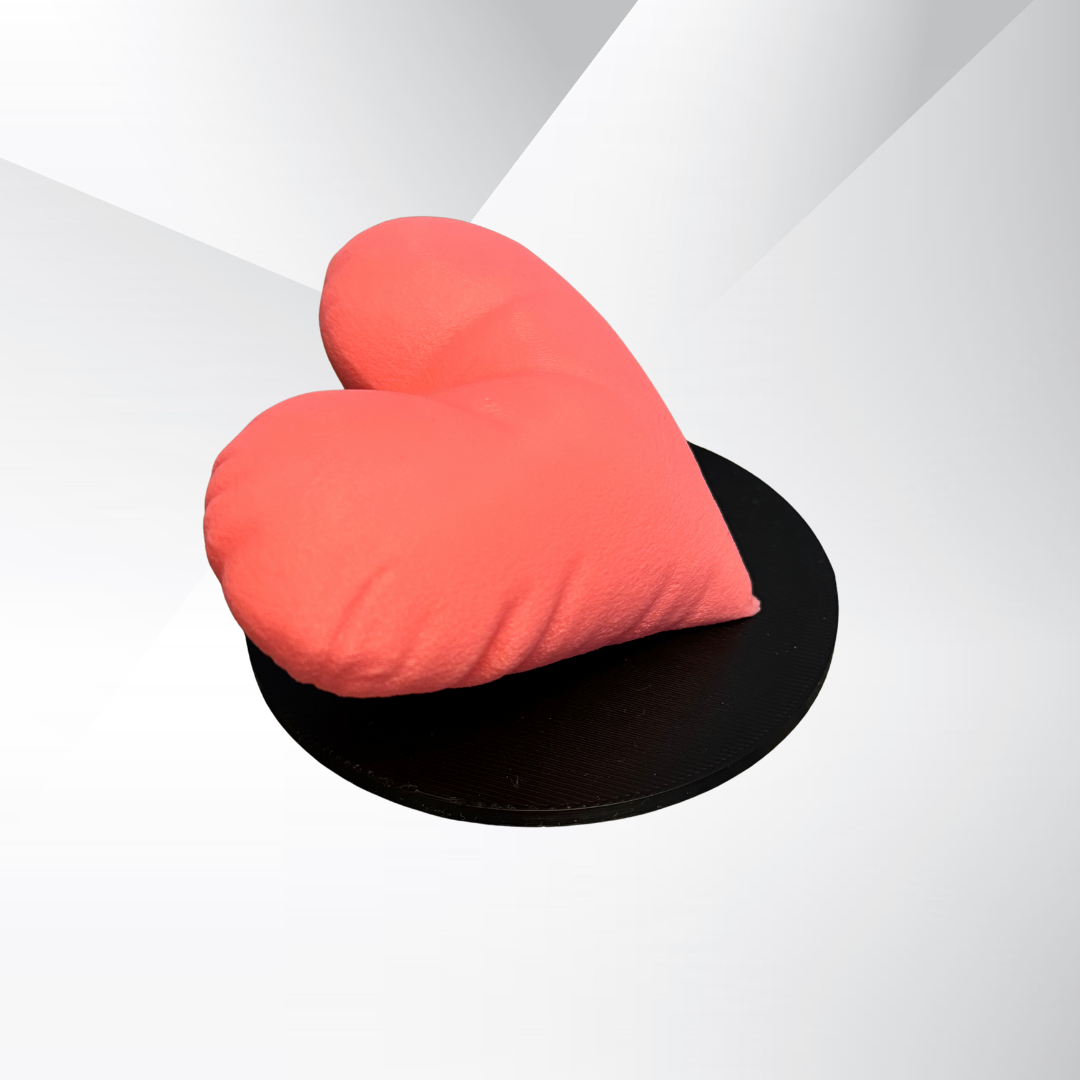 The side view of the pink 3d printed heart sculpture.