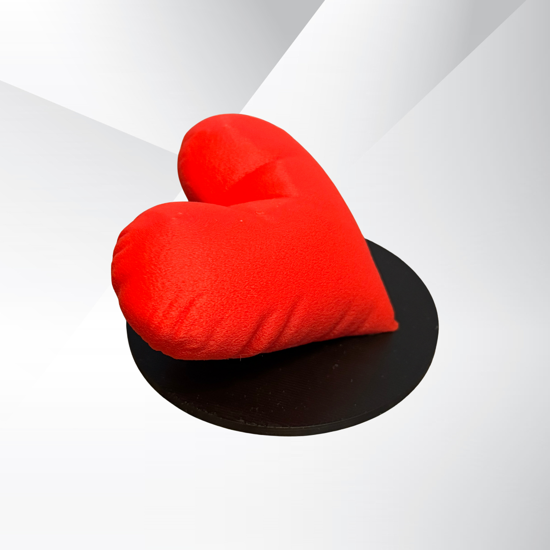 The side view of the red 3d printed heart sculpture.