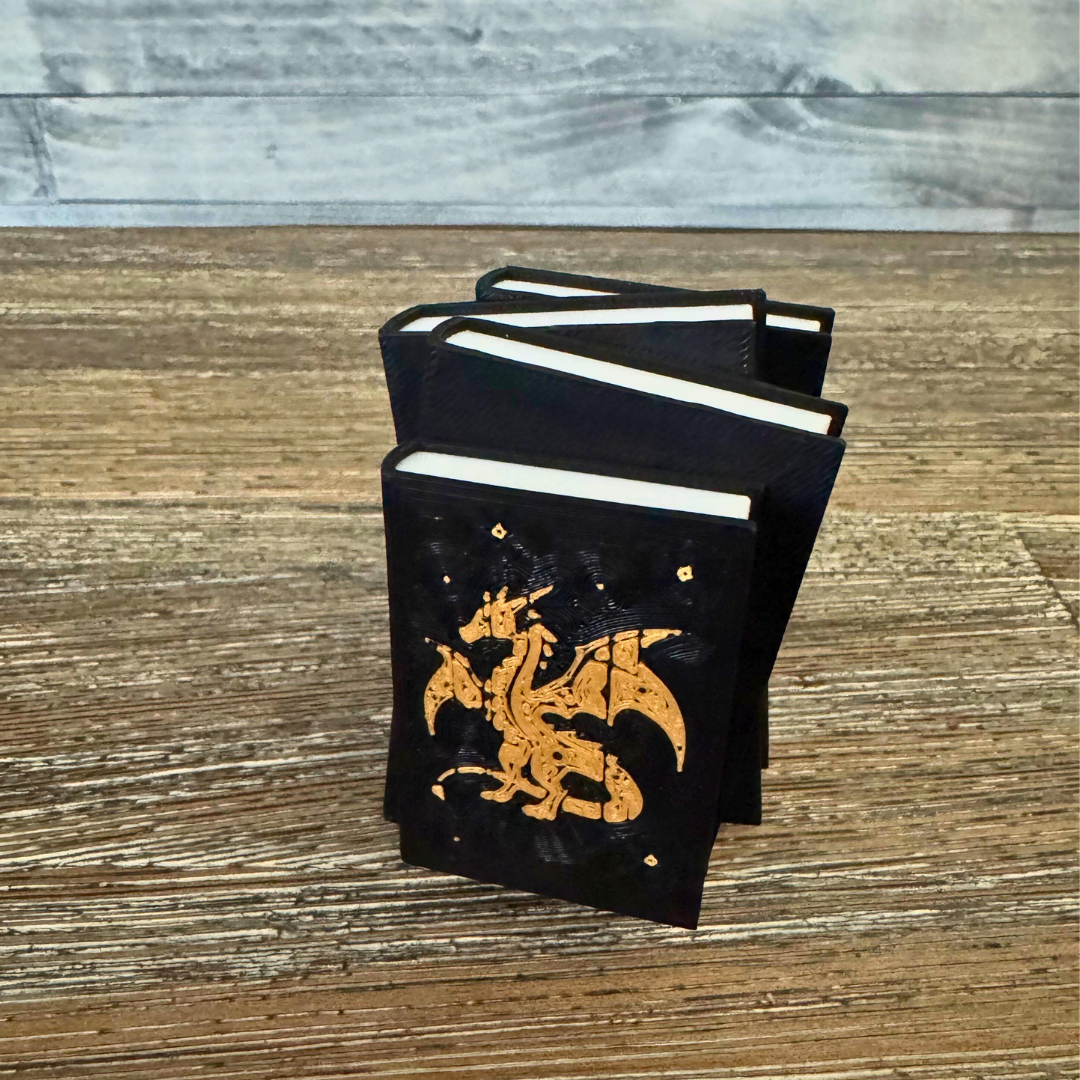 Dragon book stack standing upright on a wooden table.