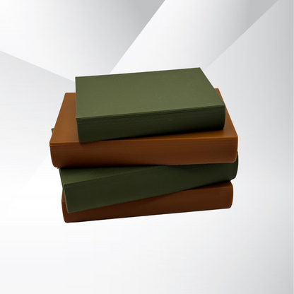 Cozy brown and green light up book stacks showing the book bindings with a white and silver background.