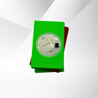 The bottom view of the poison apple light up stack of books, showing the on and off switch and where the batteries can be replaced on a white and silver background.