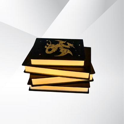 The front view of the fantasy dragon book light turned on with a white and silver background.