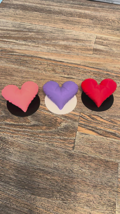 Video showing the three heart sculptures close up and their size.