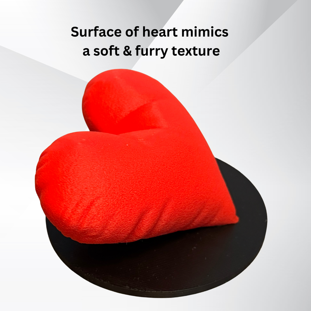 A close up view of the texture of the 3D printed heart sculpture showing that the surface of the heart mimics a soft and furry texture.